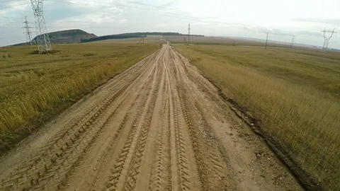 Dirt road in a field Video stock 84949157