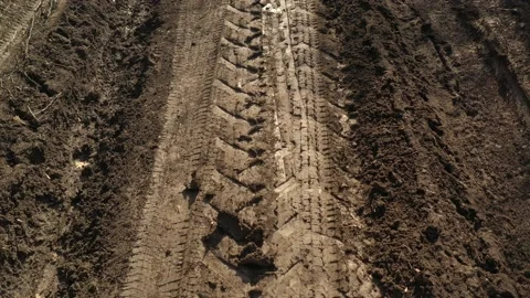 Dirt road mud after raining day 4K drone video Stock Footage 105295862