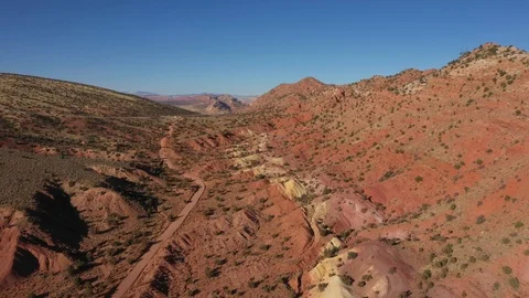 Dirt Road Pass Through The Desert With Red Sand And Rock Massif Stock Footage 119533769