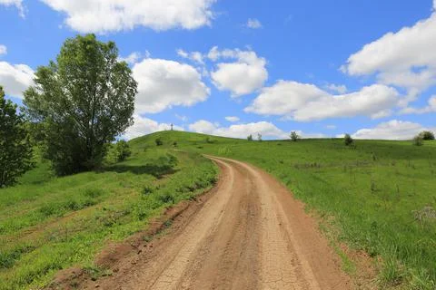 Dirt road in spring steppe Stock Photos