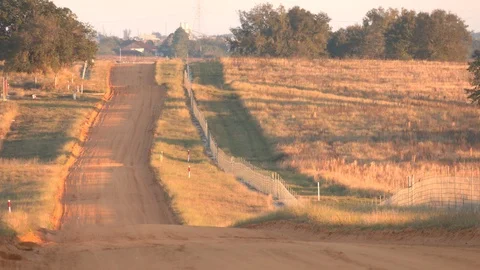 Dirt road at sunrise Stock Footage 124149356
