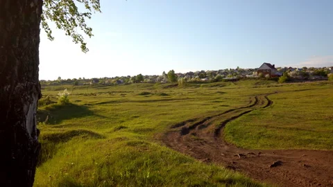 Dirt Road Through Grassy Field Stock Footage 275203612