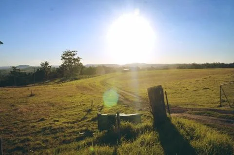 Dirt road through paddock Stock Photos