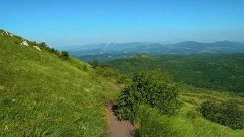 Dirt trail winds through green hillside. Mount Rtanj, Serbia Stock-Footage 342315325
