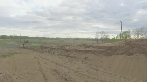 Dirtbiker hits tabletop jump Stock Footage 64222065