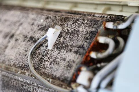Dirty Air Conditioner Temperature Sensor on Dusty Evaporator Coil Stock Photos