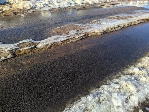 Dirty and melted snow in early spring in Russia. Stock Photos