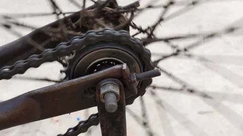 Dirty and old bycycle chain fast rotating Stock Footage 234933618