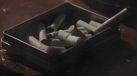 Dirty Ash Tray full of Cigarettes Stock Footage 2669239