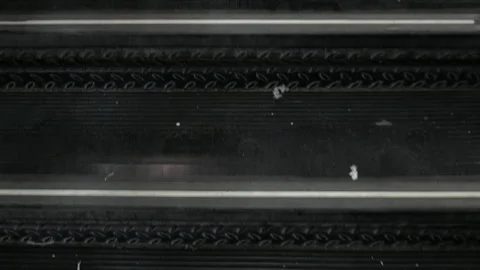 Dirty Black Escalator Steps with Litter and Wear, Close-Up Moving Up Stock Footage 342391291
