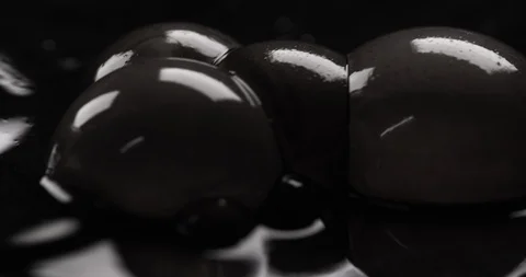 Dirty black liquid spewing disgusting bursting bubbles Stock Footage 104429820