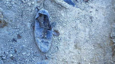 Dirty boot in mud Stock Photos