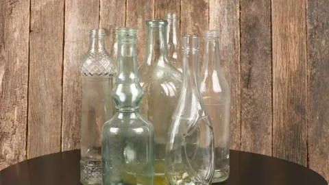 Dirty Bottles. Loop motion. Side view. Rotation 360. Stock Footage 161083224