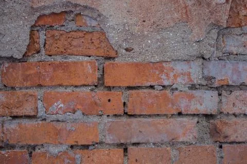 A dirty brick wall. Stock Photos