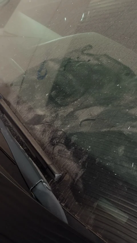 Dirty car windshield with windshield wiper and heavy dust buildup on glass Stock Footage 345765600