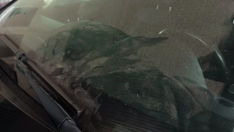 Dirty car windshield with windshield wiper and dust covered glass surface Stock Footage 345765771