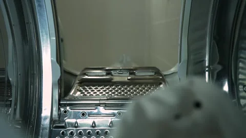 Dirty clothes fall into a top-loading washing machine. View from inside washer Video stock 247016686