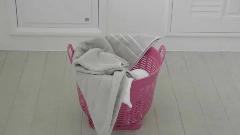 Dirty clothes falling into the laundry basket. Stock Footage 172476747