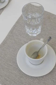 Dirty coffee cup on the table Stock Photos