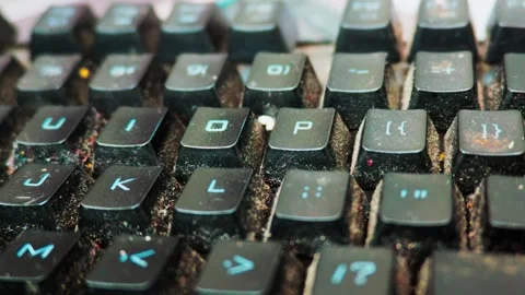 Dirty computer keyboard covered in dust and food debris 動画素材 338301733