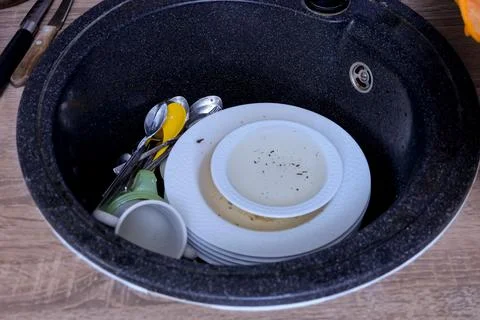 Dirty Dishes Clutter. Kitchen Full Of Used Utensils. Postdinner Mess With Stock Photos
