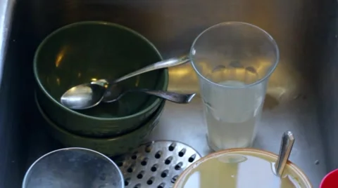 Dirty dishes in kitchen sink Stock Footage 5088341