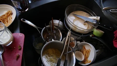 https://images.pond5.com/dirty-dishes-piled-kitchen-sink-footage-076911971_iconl.jpeg