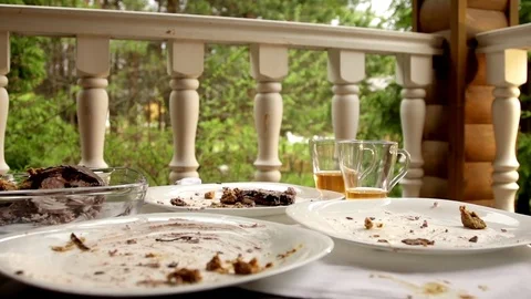 Dirty dishes on a table in slow motion Stock Footage 82731744