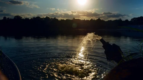 Dirty drain water flows from a pipe into the lake at golden sunset 4k 스톡 동영상 116133475