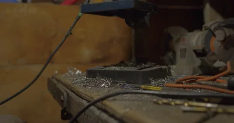 Dirty drilling tools and grinder on messy garage workshop Stock Footage 131062735