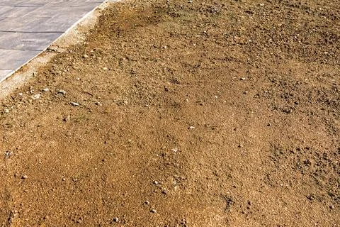 Dirty dry sand ground pattern background outside Stock Photos