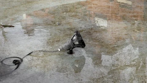 Dirty electro light lamp with a cable in an empty street fountain Video stock 229617617