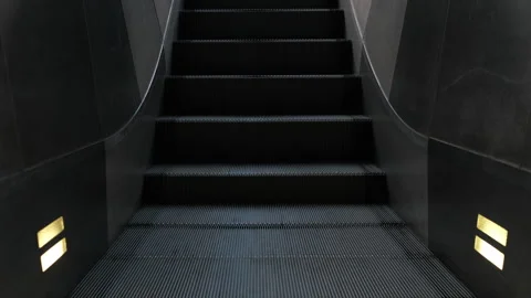 Dirty Escalator Steps Folding and Moving - Low Angle Stock Footage 321637242