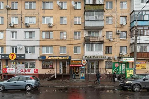 Dirty facade of the old Soviet team high-rise building Stock Photos