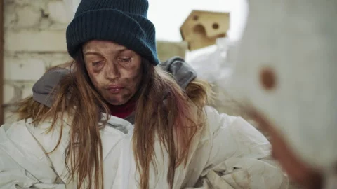 Dirty Girl in Winter Jacket Looking Down with Sad Expression Video stock 327464155