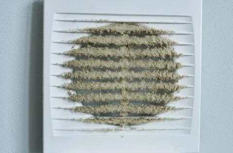 The dirty grille of a ventilation hood. Close-up. Stock Photos