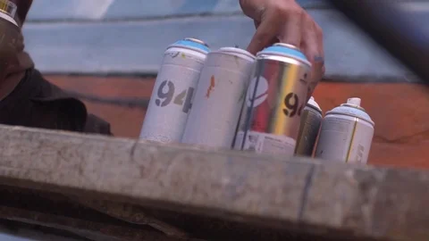 Dirty hand changing cap, aerosol cans Stock Footage 82591886