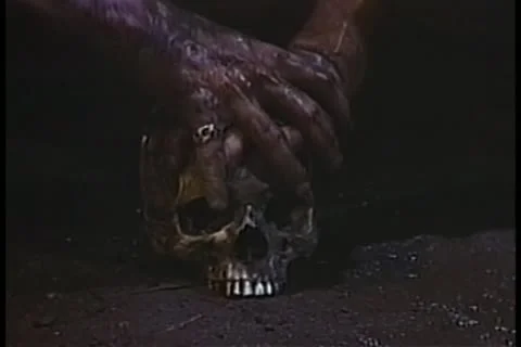 Dirty hands on skull Stock Footage 11353661