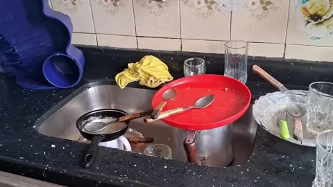 Dirty kitchen sink cluttered with unwashed dishes Stock-Footage 345009999