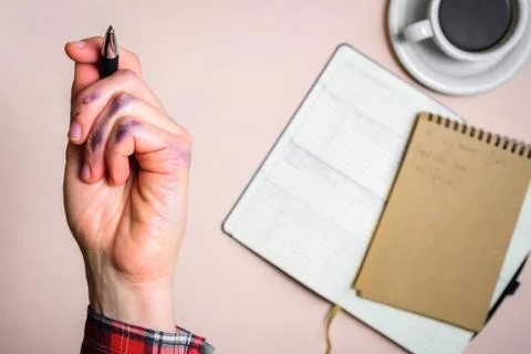 Dirty left hand after writing Stock Photos