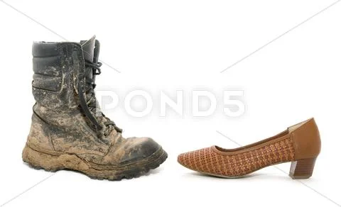 Dirty man boot and a woman shoe Stock Photos