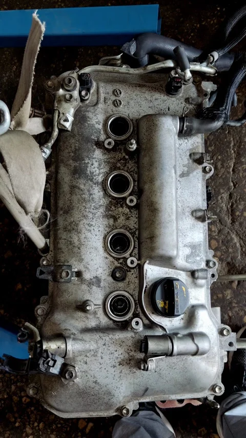 A dirty metal car engine valve cover with spark tubes. Stock Footage 339491210