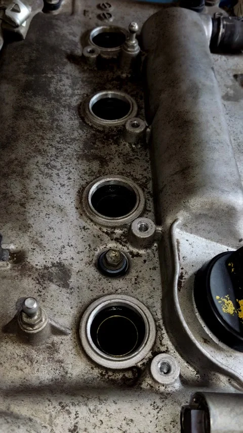 A dirty metal car engine valve cover with spark tubes. Stock Footage 339491223