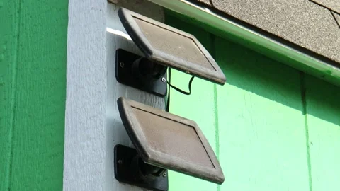 Dirty Mini Solar Panels on the Side of Backyard Shed Stock Footage 160447604