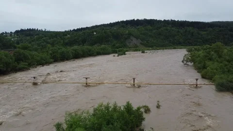 Dirty mountain river with a strong current on a background of beautiful Stock Footage 197486341