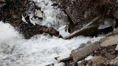 Dirty mountain stream cold in the fall Stock Footage 122470565