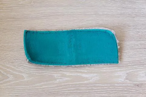 A dirty old floor rag. replacing the floor cleaning cloth. Floor cleaning mop Stock Photos