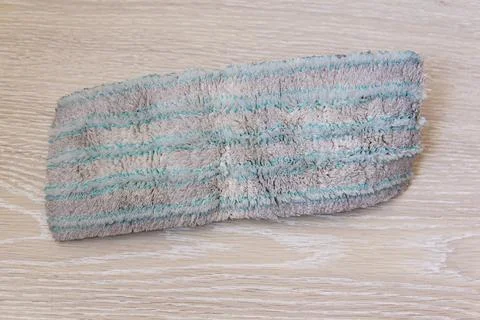 A dirty old floor rag. replacing the floor cleaning cloth. Floor cleaning mop Stock Photos
