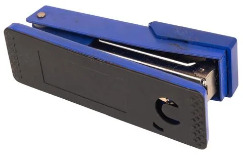 Dirty old stapler on white background Stock Photos