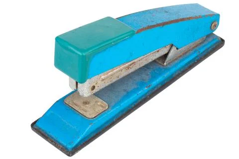 Dirty old stapler on white background Stock Photos